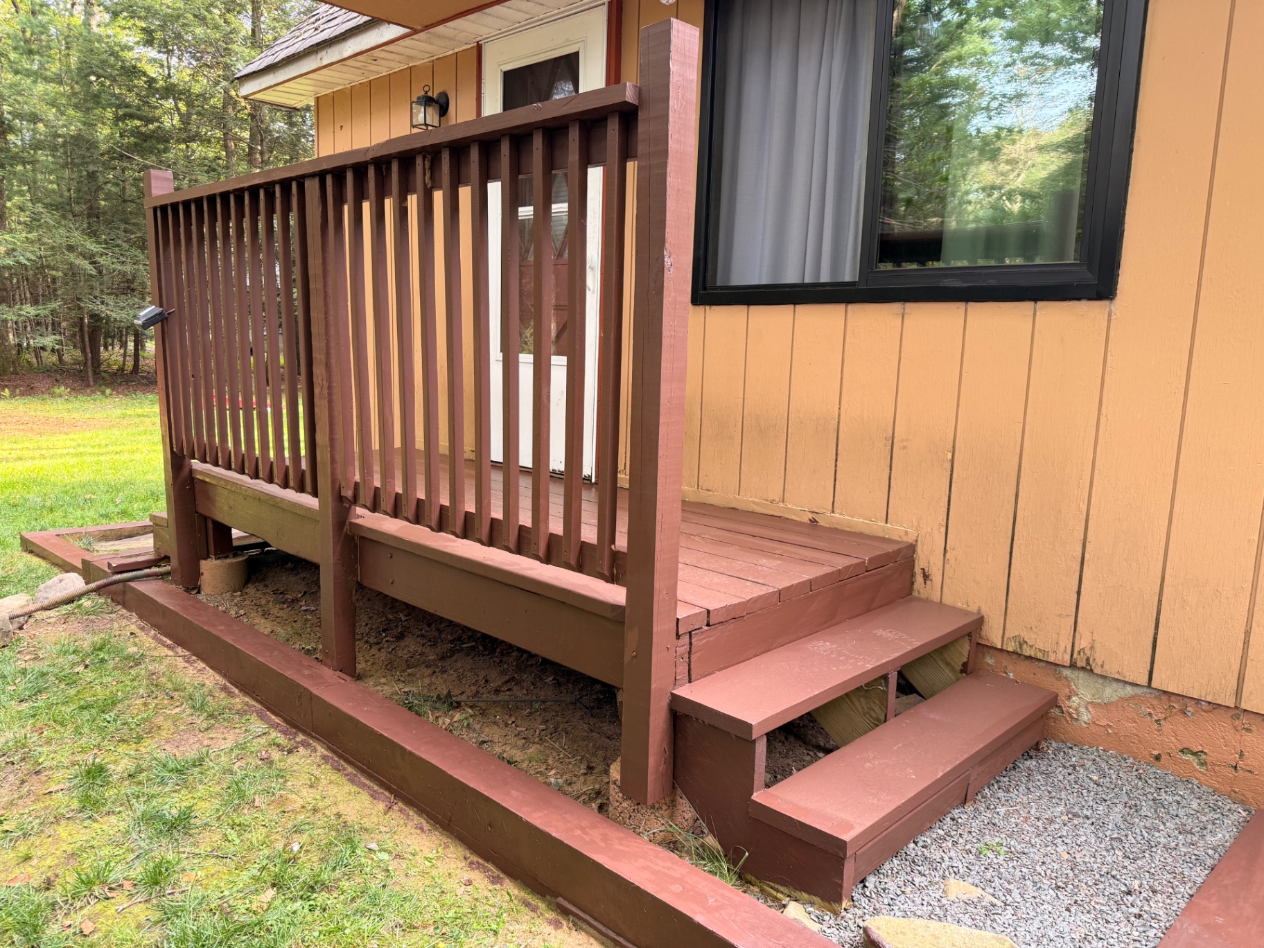 Completed side deck railing and repaired exterior stairs