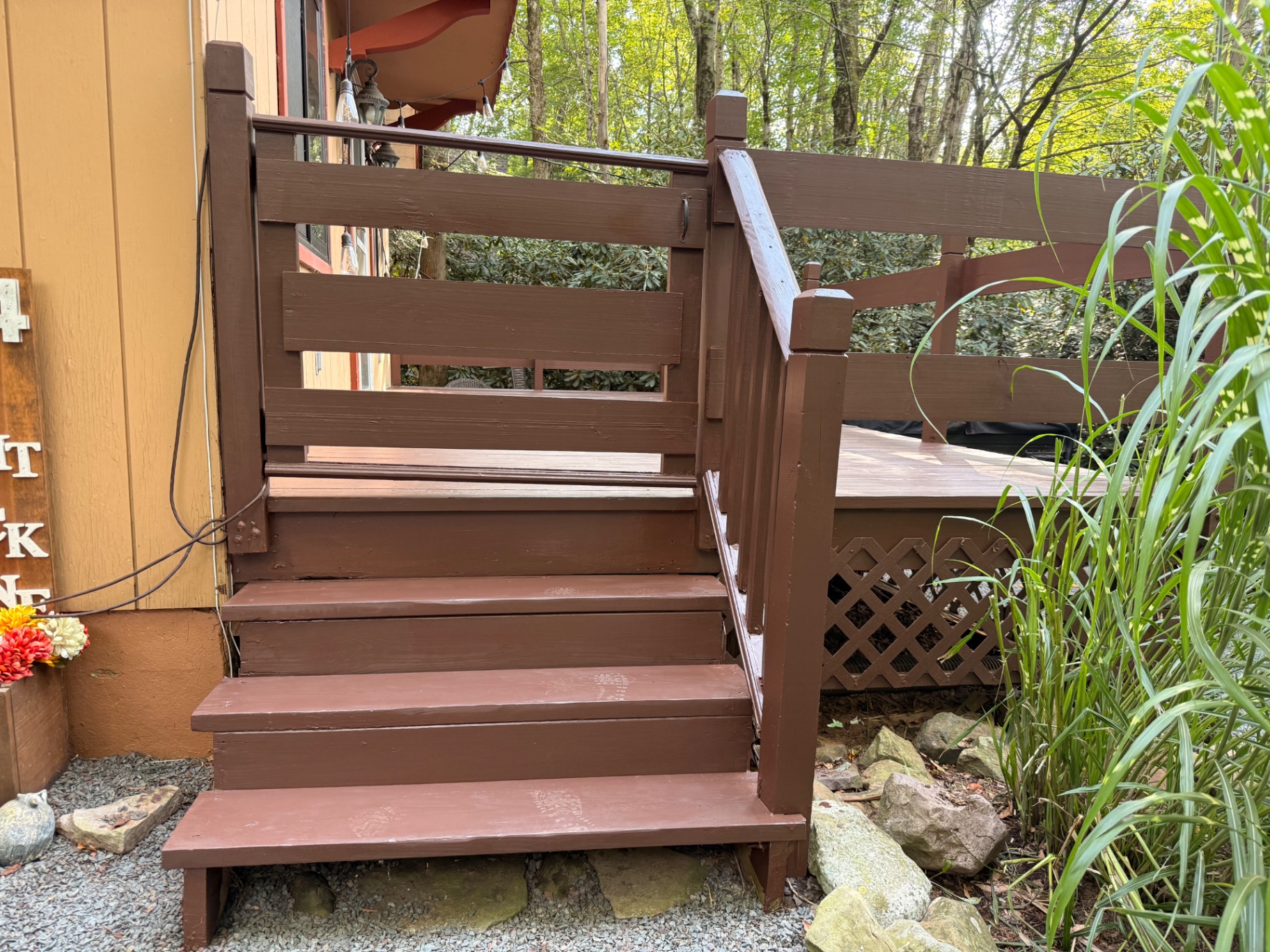 Finished deck stairs, railing, and posts after restoration