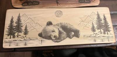 Hand-finished wildlife artwork on a maple board in the Saw & Cedar workshop