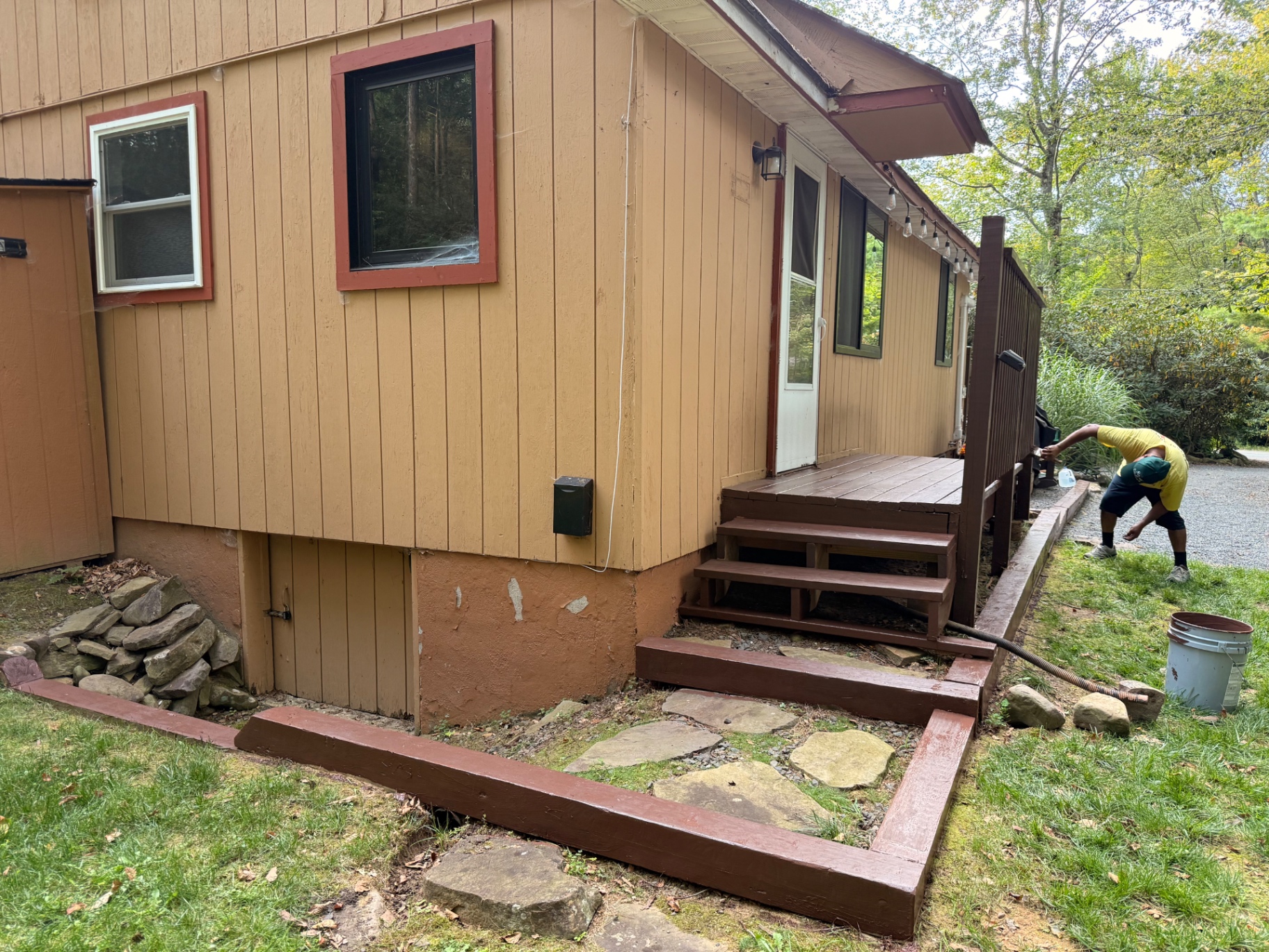 Wide view of the completed deck restoration and repaired stairs