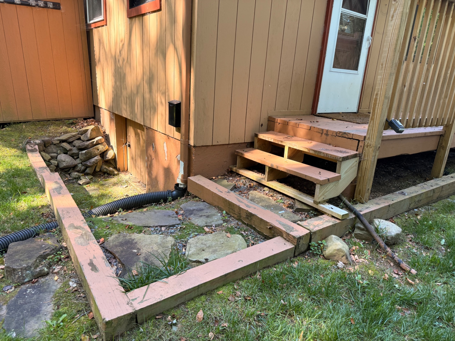 Deck stair repairs underway before exterior refinishing