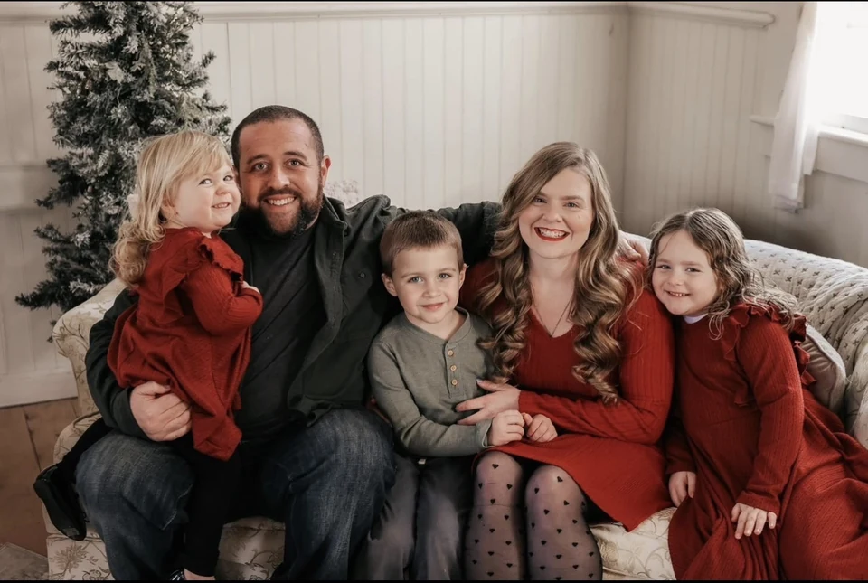 Eric Karlin, owner of Saw & Cedar, with his wife and their three children at home in Albrightsville, Pennsylvania