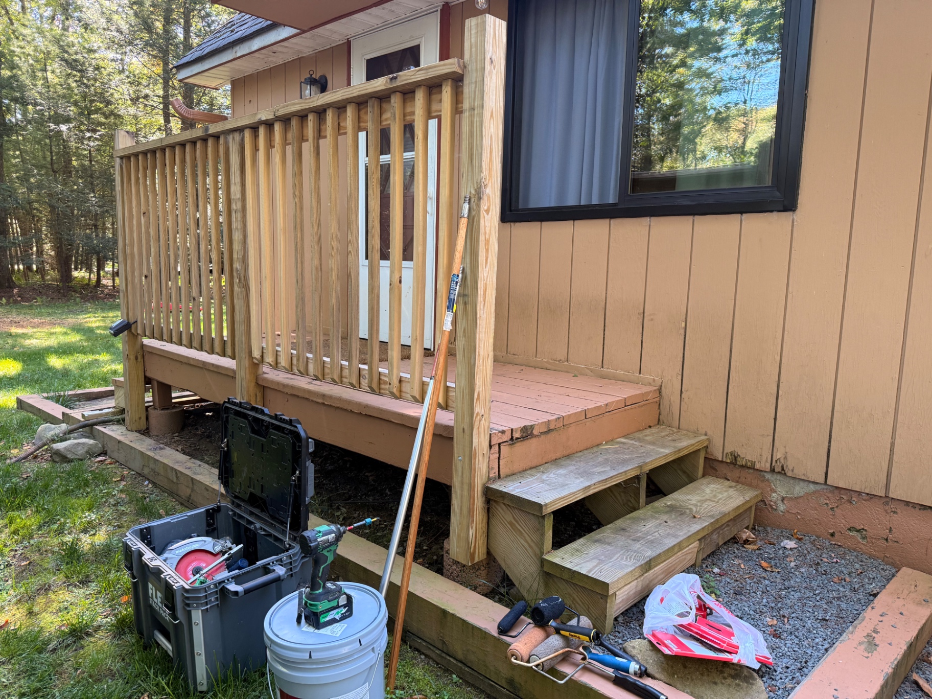 Exterior deck railing and stair repair underway